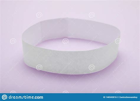 white blank paper wristband bracelet mockup  purple background stock photo image