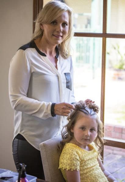mom creates beautiful intricate braids in daughter s hair