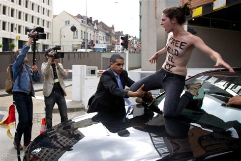 topless femen protester get choked out for jumping on the car of tunisian pm ali larayedh in