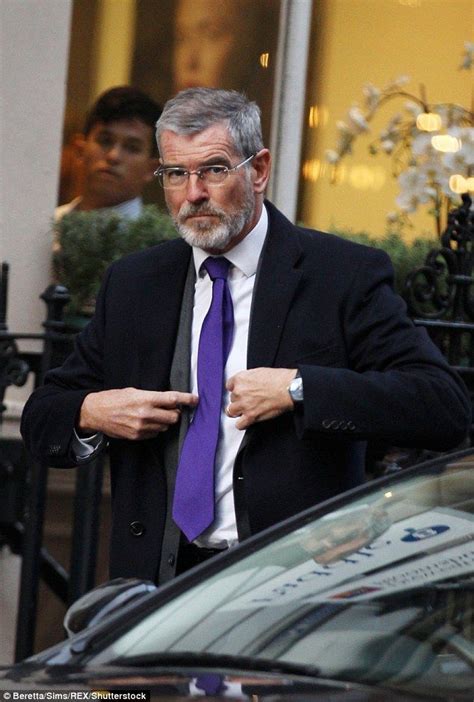 Pierce Brosnan Shows Off His Greying Hair And White Beard