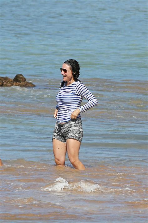 julia louis dreyfus in bikini top at a beach in maui