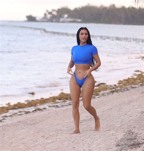 kim kardashian in bikini at a photoshoot for her skims swimwear line 01