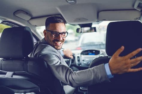 premium photo rear view  cheerful caucasian businessman driving   work hands