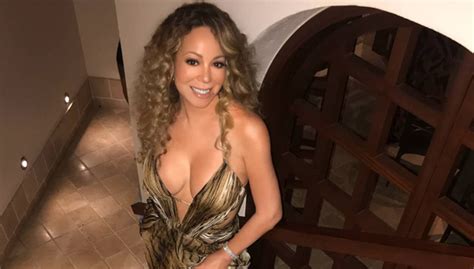 Mariah Carey Flaunts Cleavage In Tiger Printed Gown See New Pic