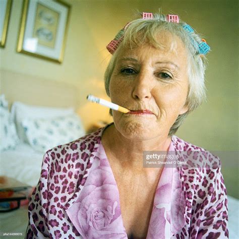 mature woman smoking cigarette portrait foto de stock getty images
