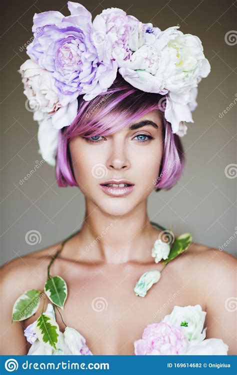 portrait of beautiful woman with wreath made of peony