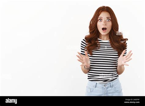 Excited And Amazed Nervous Young Redhead Woman Drop Jaw Gasping With