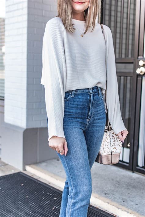 wearing a 23 ribbed knit amazon top paired with paige jeans and white