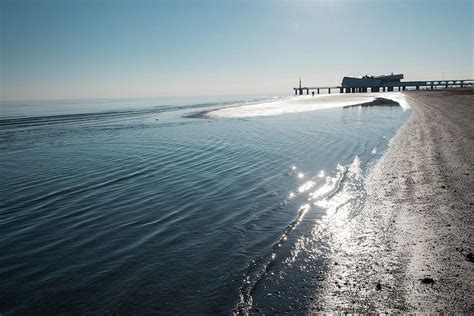 Strolling Along The Beach Photograph By Nicola Simeoni Fine Art America