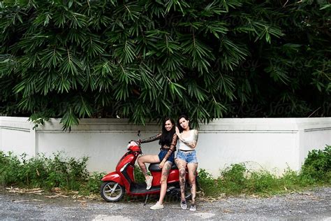 Tattooed Girlfriends On Motorbike In Jungle By Ivan Gener For Stocksy