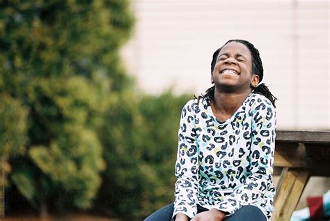 Black Girl Having A Laugh By Stocksy Contributor Gabi Bucataru