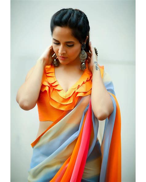 anasuya bharadwaj hot look in silk saree and orange blouse