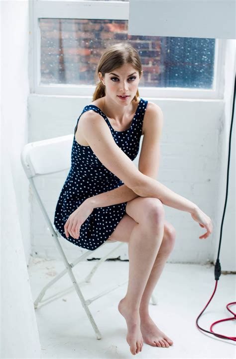 Beautiful Brunette Woman Sitting Crossed Legs Wearing A Polka Dot Blue