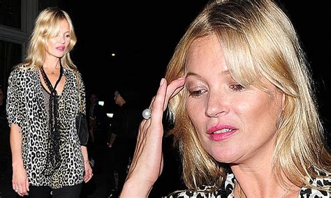kate moss turns heads in plunging leopard print blouse in