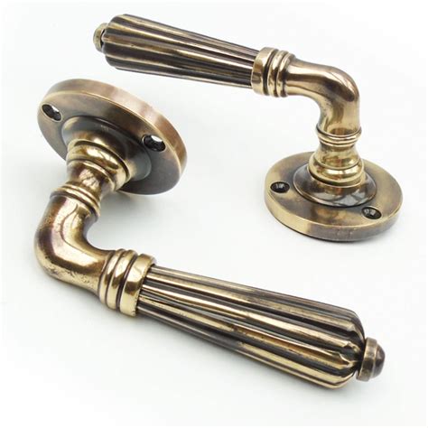 vintage regency style reeded rose lever door handles aged brass