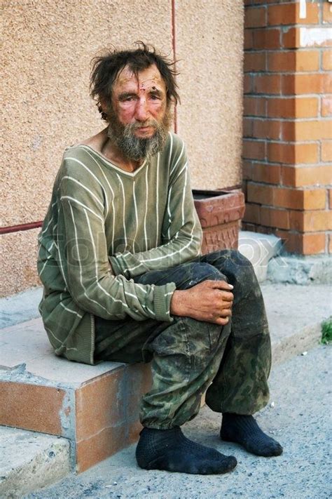 stock image of homeless man on a city street homeless man homeless