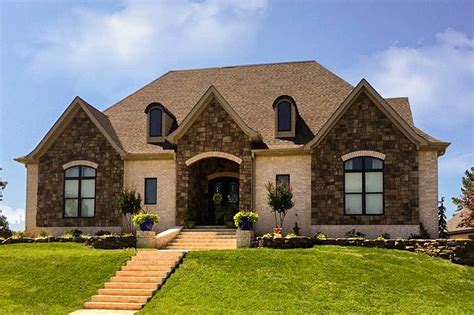 story home plan  open great room   master suites  architectural designs