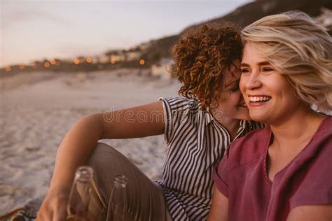 Laughing Lesbian Couple Having Fun Together At The Beach Stock Image