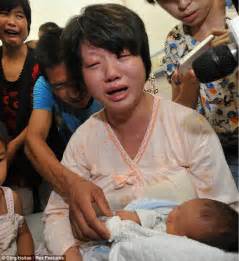 emotion dong wan cries as she holds her newborn son after being reunited with him in hospital