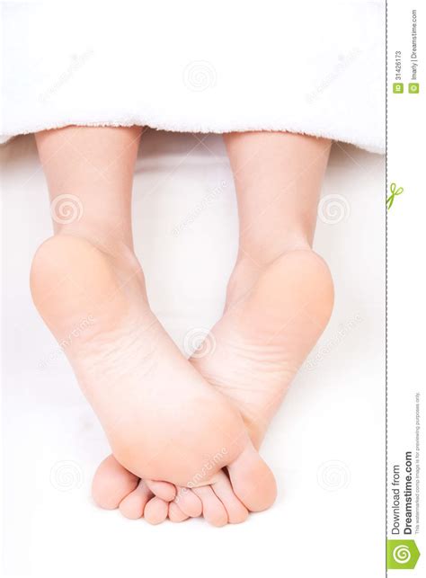 Feet Of Relaxed Woman Lying On The Massage Table Stock