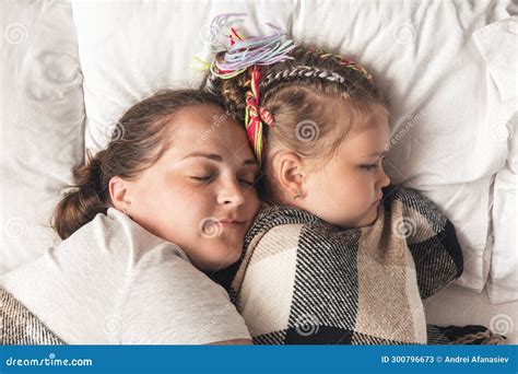 Young Mother With Daughter Sleeping In Bed Stock Image Image Of Lying