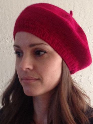 woman wearing  red knitted hat     camera