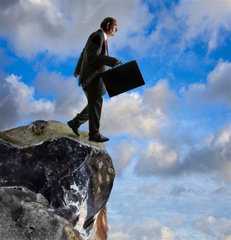 man running   cliff conceptual image stock image