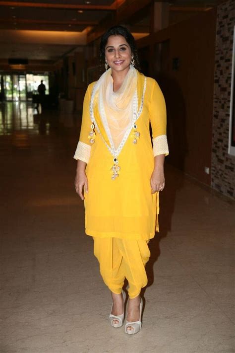 vidya balan wearing the nikasha dhoti and kurta set in mango with a printed scarf style in