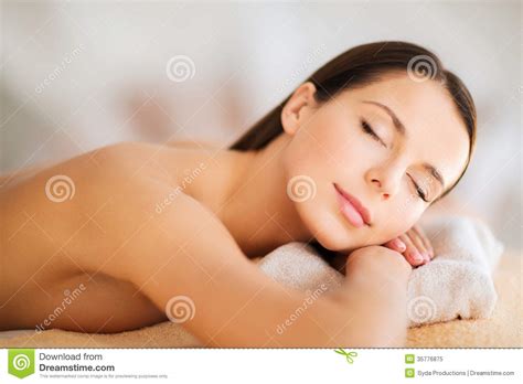 beautiful woman with closed eyes in spa stock image