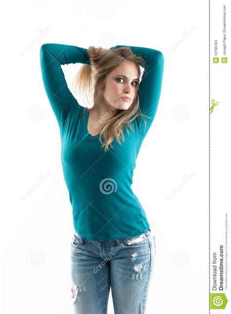 girl next door in jeans holding hair and looking f stock images image 12785784