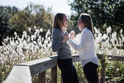 a sandcastle beach proposal and train engagement photo session equally wed modern lgbtq