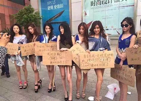 chinese models dress up as beggars after auto shanghai ban daily mail