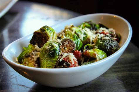 seared brussle sprouts topped  smaoked tomatoes basil  parmesan brussle sprouts