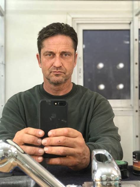 watch gerard butler lose his beard as he gets a clean shave after a