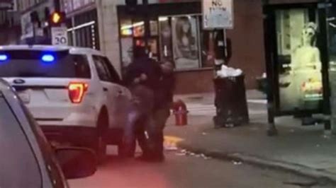 video shows police slamming man who allegedly spit at officer to th