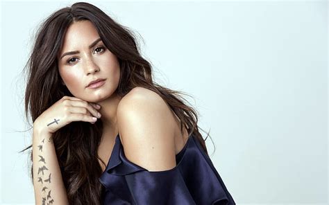 Demi Lovato American Singer Portrait Tattoo On Hand Blue Dress