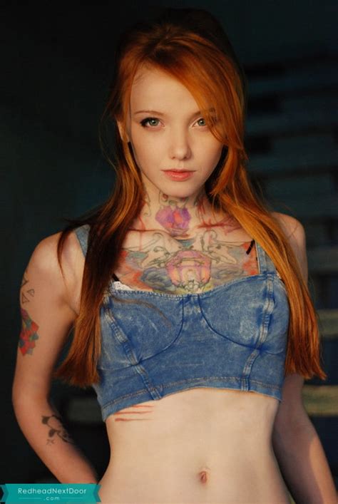 how many tattoos does she have redhead next door photo