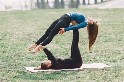 determine women  acro yoga exercise   stock photo