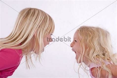Two Blonde Girls Screaming At Each Other Download People