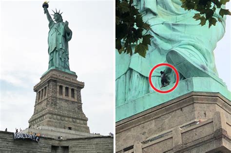 Statue Of Liberty Protest Woman Climbs New York Monument