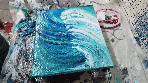 fluid acrylic pour painting light blue swipe  canvas sea effect