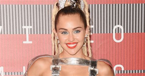 see all of the ridiculously revealing outfits miley cyrus wore at the