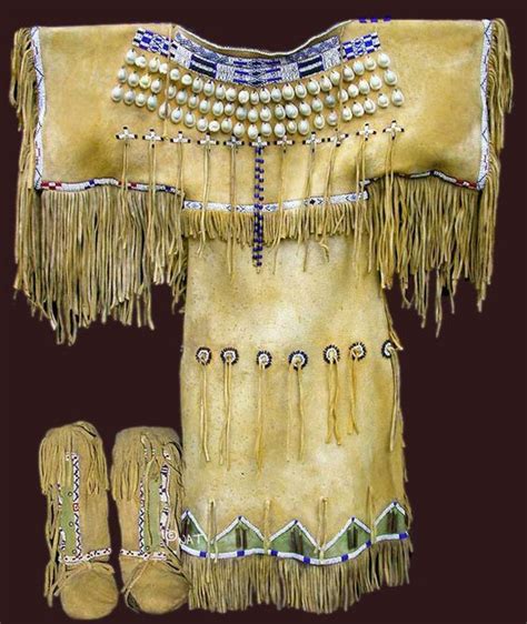 A Superb Sioux Fringed Buckskin Dress And Moccasin Outfit Native