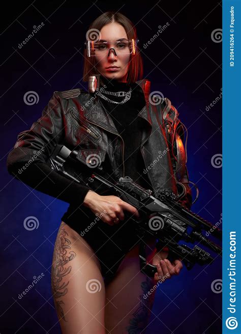 Seductive Woman With Naked And Tattooed Legs Holding Futuristic Rifle