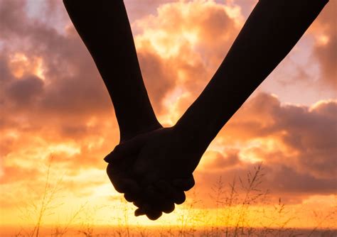 silhouette of couple holding hands at sunset vanessa atterbeary