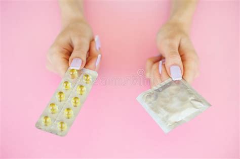Contraception Birth Control Pills And An Unwrapped Condom Colo Stock