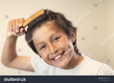 boy brushing hair royalty  images stock  pictures