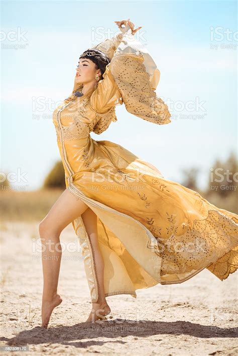 beautiful woman like egyptian queen cleopatra on in desert outdoor