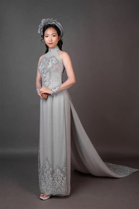 grey wedding ao dai with long train beautiful lace and hand beading in