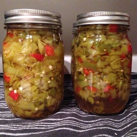 jars filled  pickled vegetables sitting  top   table